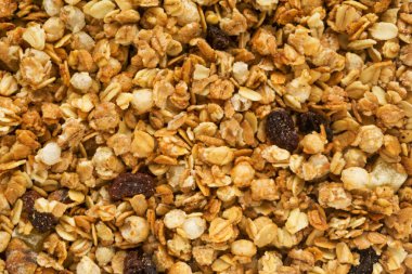 Fırınlanmış sarı müsli arka plan, mısır gevreği dokusu yakın çekim