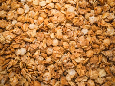 Fırınlanmış sarı müsli arka plan, mısır gevreği dokusu yakın çekim