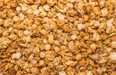 Fırınlanmış sarı müsli arka plan, mısır gevreği dokusu yakın çekim