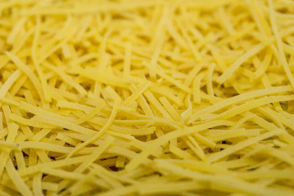 Tagliatelle Secche Consistenza Fondo Pasta Gialla Piccoli Vermicelli Maccheroni Cucina — Foto Stock