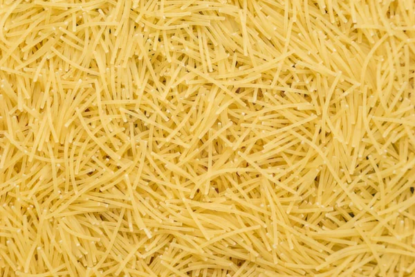 Trockene Nudelkonsistenz Gelber Nudelhintergrund Kleine Nudelvermicelli Oder Makkaroni Traditionelle Italienische — Stockfoto