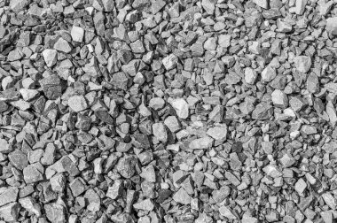 Yol taşları çakıl dokusu, inşaat için kayalar ezilmiş granit çakıl taşlarının arka planı, küçük kayalar, yakın çekim.