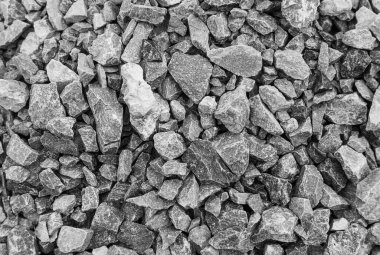 Yol taşları çakıl dokusu, inşaat için kayalar ezilmiş granit çakıl taşlarının arka planı, küçük kayalar, yakın çekim.