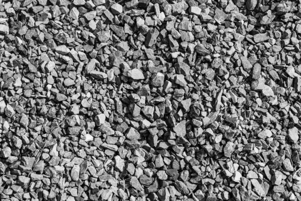 Yol taşları çakıl dokusu, inşaat için kayalar ezilmiş granit çakıl taşlarının arka planı, küçük kayalar, yakın çekim.