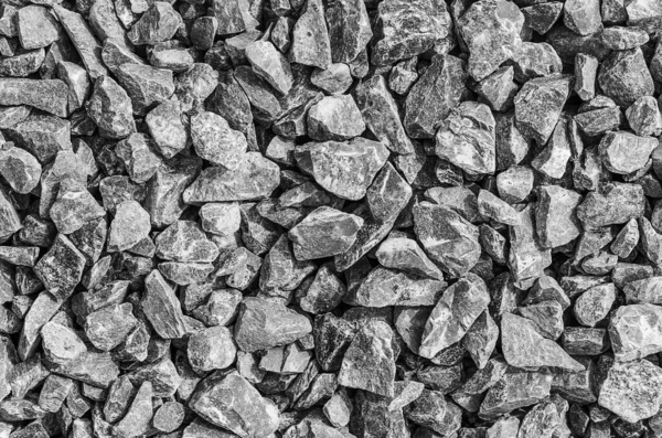 Yol taşları çakıl dokusu, inşaat için kayalar ezilmiş granit çakıl taşlarının arka planı, küçük kayalar, yakın çekim.