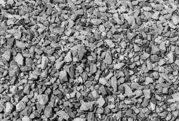 Yol taşları çakıl dokusu, inşaat için kayalar ezilmiş granit çakıl taşlarının arka planı, küçük kayalar, yakın çekim.
