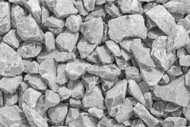 Beyaz yol taşları çakıl dokusu, inşaat için kayalar ezilmiş granit çakıl taşlarının gri arkaplanı, küçük kayalar, yakın çekim.