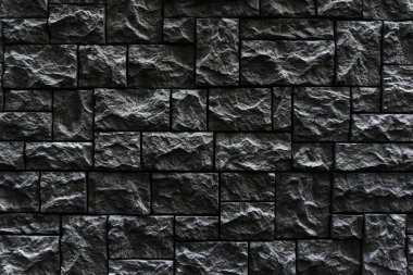 Modern siyah tuğla duvar. Dekoratif taş duvar arkaplanı deseni. Yüzey siyah duvar dokusu