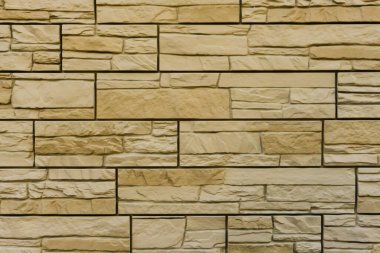 Modern sarı tuğla duvar. Dekoratif taş duvar arkaplanı deseni. Yüzey kahverengi duvar dokusu