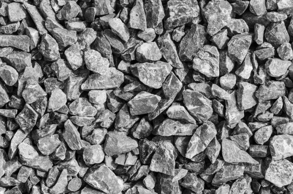 Yol taşları çakıl dokusu, inşaat için kayalar ezilmiş granit çakıl taşlarının arka planı, küçük kayalar, yakın çekim.