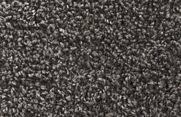 Black shaggy carpet texture, rug with short wool background