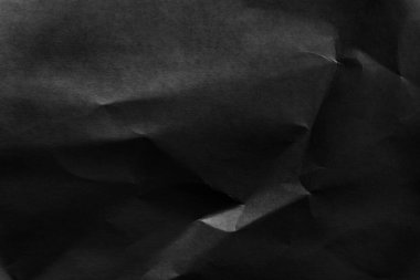 Siyah buruşmuş kağıt arkaplan, eski eski kağıt kırışıklıklarının gri dokusu, gri kağıt yüzeyinde kırışıklıklar