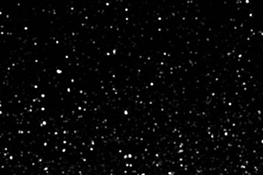 Siyah zemin üzerinde kaotik beyaz bokeh, ışık lekeleri dokusu, soyutlama, düşen kar