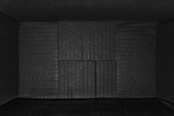 top view of deep empty cardboard box, opened black paper carton box, empty cardboard box close up, inside view