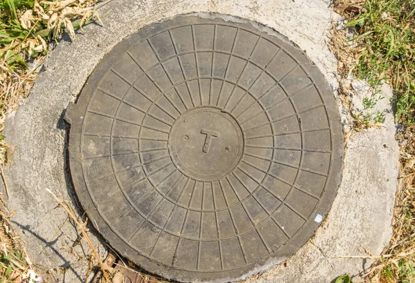 Cast Iron Sewer Cover Park Entrance Sewer Royalty Free Stock Images