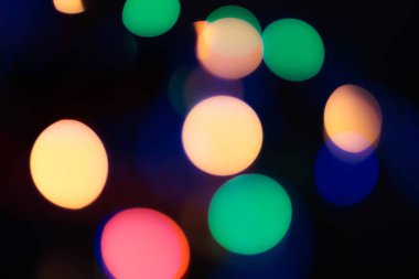 Soyut renkli, odaklanmış dairesel fakül. Bokeh bulanık renk ışığı arka planı kullanabilir. Yeni yıl Bokeh feshi