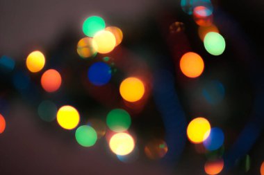 Soyut renkli, odaklanmış dairesel fakül. Bokeh bulanık renk ışığı arka planı kullanabilir. Yeni yıl Bokeh feshi