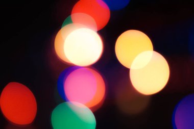 Soyut renkli, odaklanmış dairesel fakül. Bokeh bulanık renk ışığı arka planı kullanabilir. Yeni yıl Bokeh feshi