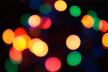 Soyut renkli, odaklanmış dairesel fakül. Bokeh bulanık renk ışığı arka planı kullanabilir. Yeni yıl Bokeh feshi