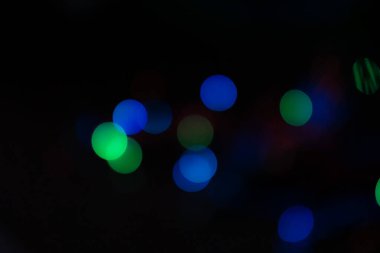 Soyut renkli, odaklanmış dairesel fakül. Bokeh bulanık renk ışığı arka planı kullanabilir. Yeni yıl Bokeh feshi