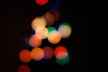 Soyut renkli, odaklanmış dairesel fakül. Bokeh bulanık renk ışığı arka planı kullanabilir. Yeni yıl Bokeh feshi