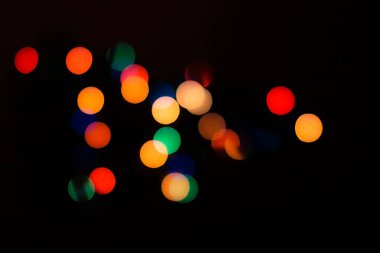 Soyut renkli, odaklanmış dairesel fakül. Bokeh bulanık renk ışığı arka planı kullanabilir. Yeni yıl Bokeh feshi