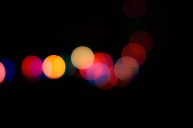 Soyut renkli, odaklanmış dairesel fakül. Bokeh bulanık renk ışığı arka planı kullanabilir. Yeni yıl Bokeh feshi