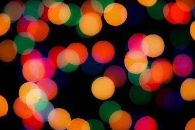 Soyut renkli, odaklanmış dairesel fakül. Bokeh bulanık renk ışığı arka planı kullanabilir. Yeni yıl Bokeh feshi