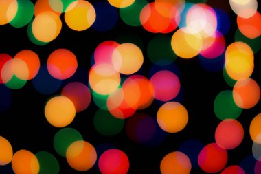 Soyut renkli, odaklanmış dairesel fakül. Bokeh bulanık renk ışığı arka planı kullanabilir. Yeni yıl Bokeh feshi