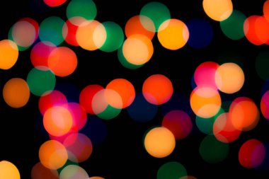 Soyut renkli, odaklanmış dairesel fakül. Bokeh bulanık renk ışığı arka planı kullanabilir. Yeni yıl Bokeh feshi