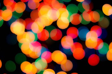 Soyut renkli, odaklanmış dairesel fakül. Bokeh bulanık renk ışığı arka planı kullanabilir. Yeni yıl Bokeh feshi