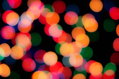 Soyut renkli, odaklanmış dairesel fakül. Bokeh bulanık renk ışığı arka planı kullanabilir. Yeni yıl Bokeh feshi