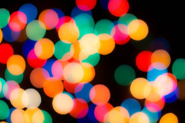 Soyut renkli, odaklanmış dairesel fakül. Bokeh bulanık renk ışığı arka planı kullanabilir. Yeni yıl Bokeh feshi