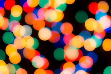 Soyut renkli, odaklanmış dairesel fakül. Bokeh bulanık renk ışığı arka planı kullanabilir. Yeni yıl Bokeh feshi