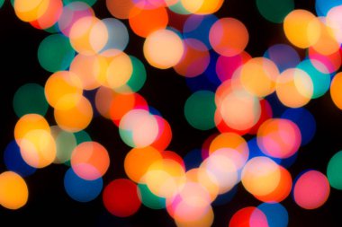 Soyut renkli, odaklanmış dairesel fakül. Bokeh bulanık renk ışığı arka planı kullanabilir. Yeni yıl Bokeh feshi