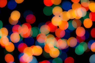 Soyut renkli, odaklanmış dairesel fakül. Bokeh bulanık renk ışığı arka planı kullanabilir. Yeni yıl Bokeh feshi