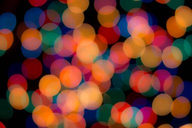 Soyut renkli, odaklanmış dairesel fakül. Bokeh bulanık renk ışığı arka planı kullanabilir. Yeni yıl Bokeh feshi