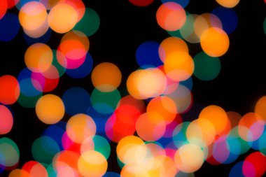 Soyut renkli, odaklanmış dairesel fakül. Bokeh bulanık renk ışığı arka planı kullanabilir. Yeni yıl Bokeh feshi