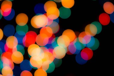 Soyut renkli, odaklanmış dairesel fakül. Bokeh bulanık renk ışığı arka planı kullanabilir. Yeni yıl Bokeh feshi