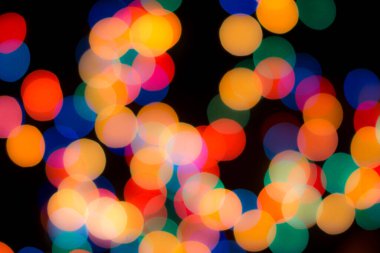 Soyut renkli, odaklanmış dairesel fakül. Bokeh bulanık renk ışığı arka planı kullanabilir. Yeni yıl Bokeh feshi