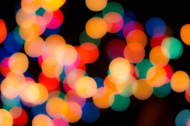 Soyut renkli, odaklanmış dairesel fakül. Bokeh bulanık renk ışığı arka planı kullanabilir. Yeni yıl Bokeh feshi