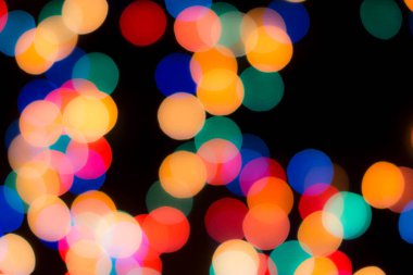 Soyut renkli, odaklanmış dairesel fakül. Bokeh bulanık renk ışığı arka planı kullanabilir. Yeni yıl Bokeh feshi