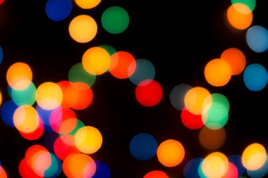 Soyut renkli, odaklanmış dairesel fakül. Bokeh bulanık renk ışığı arka planı kullanabilir. Yeni yıl Bokeh feshi