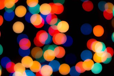 Soyut renkli, odaklanmış dairesel fakül. Bokeh bulanık renk ışığı arka planı kullanabilir. Yeni yıl Bokeh feshi