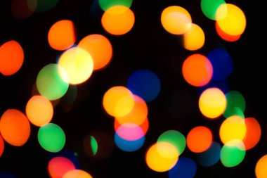 Soyut renkli, odaklanmış dairesel fakül. Bokeh bulanık renk ışığı arka planı kullanabilir. Yeni yıl Bokeh feshi