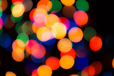 Soyut renkli, odaklanmış dairesel fakül. Bokeh bulanık renk ışığı arka planı kullanabilir. Yeni yıl Bokeh feshi