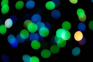 Soyut renkli, odaklanmış dairesel fakül. Bokeh bulanık renk ışığı arka planı kullanabilir. Yeni yıl Bokeh feshi