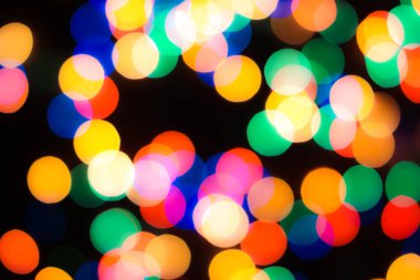 Soyut renkli, odaklanmış dairesel fakül. Bokeh bulanık renk ışığı arka planı kullanabilir. Yeni yıl Bokeh feshi