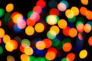 Soyut renkli, odaklanmış dairesel fakül. Bokeh bulanık renk ışığı arka planı kullanabilir. Yeni yıl Bokeh feshi