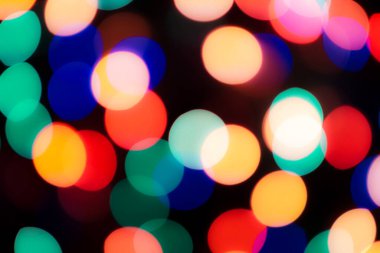 Soyut renkli, odaklanmış dairesel fakül. Bokeh bulanık renk ışığı arka planı kullanabilir. Yeni yıl Bokeh feshi